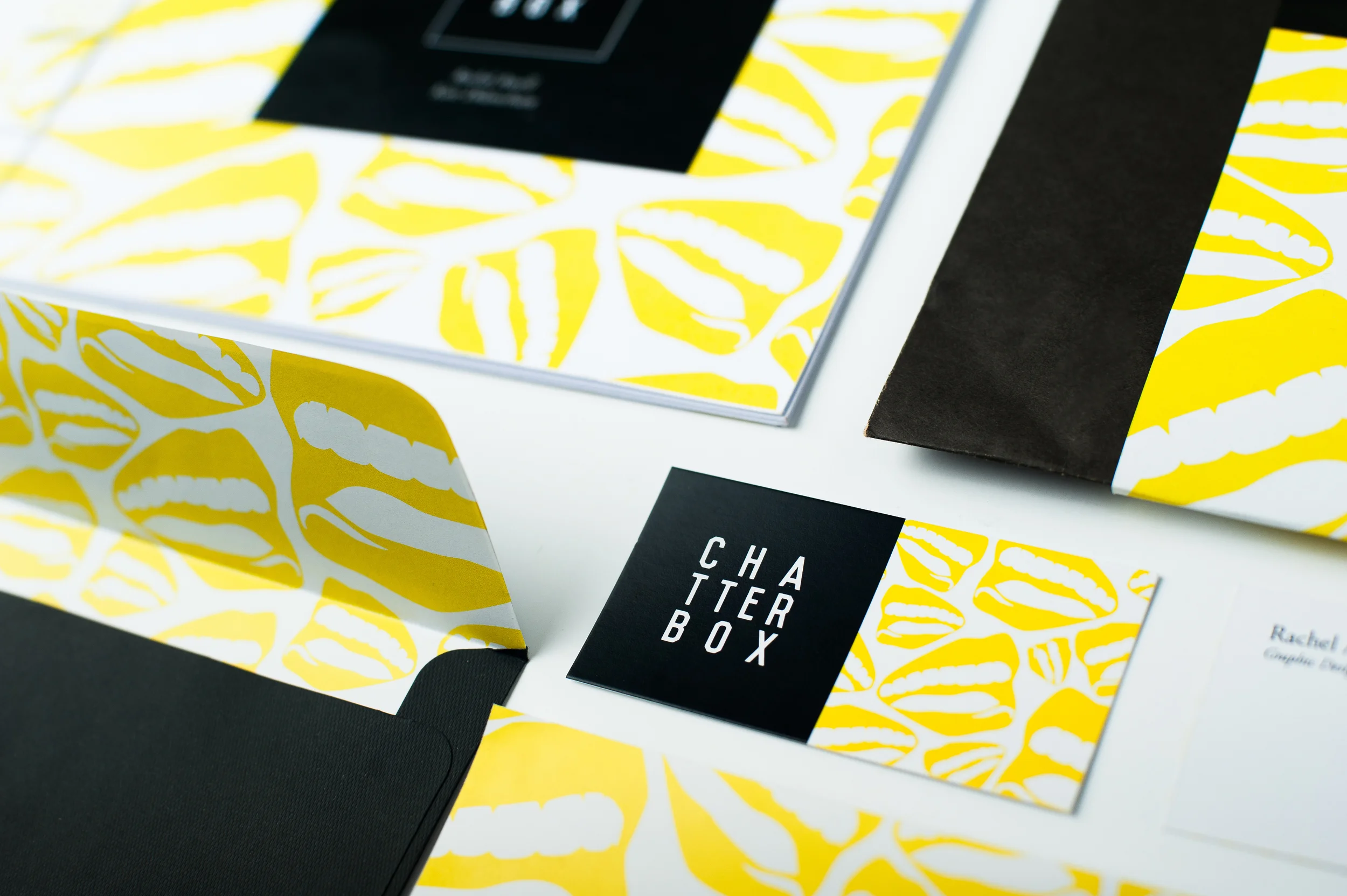     The concept of a box is explored in the typography and overall aesthetic of the design. 