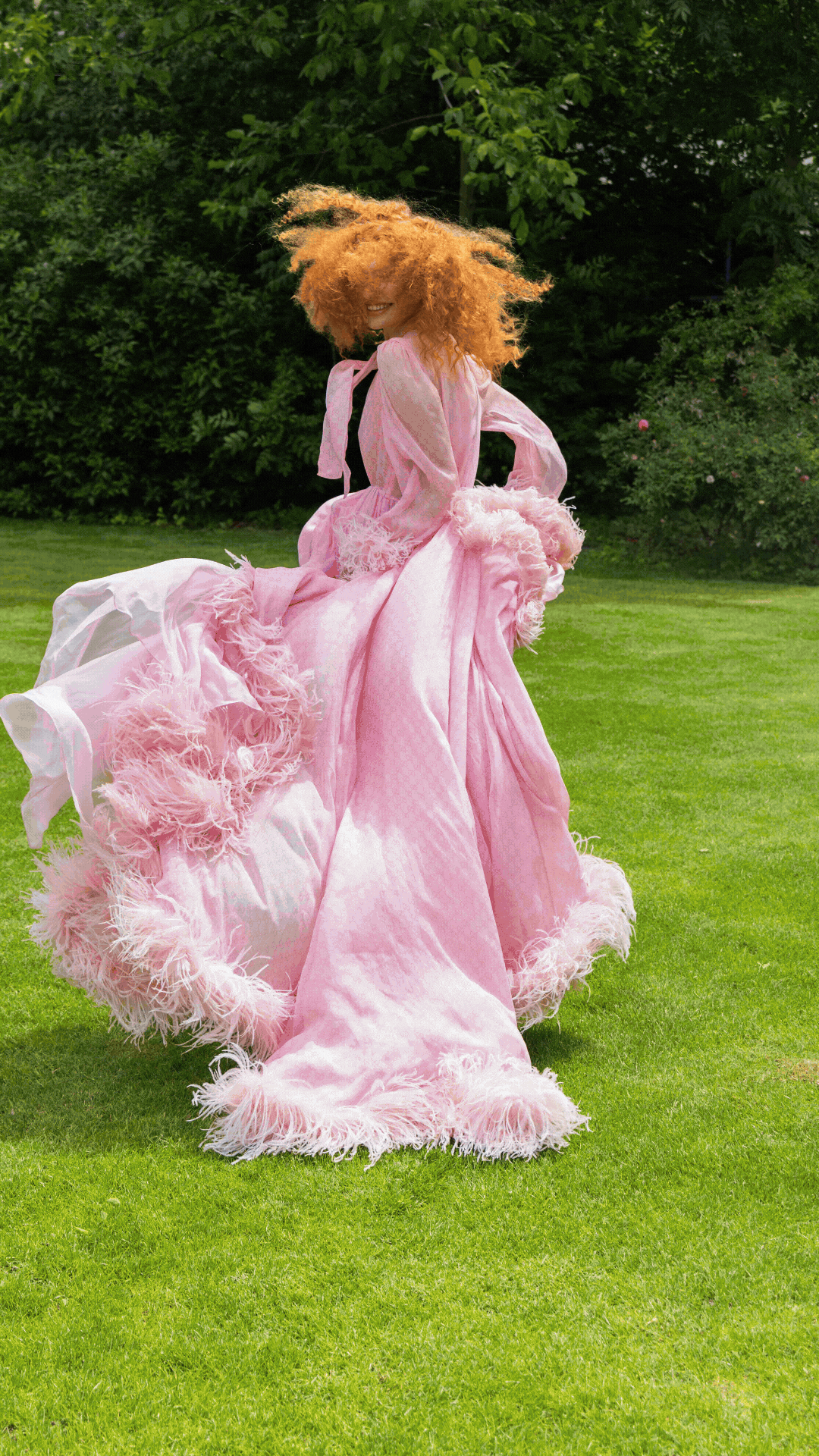 Gucci luxury fashion editorial styled by Mike York, international Fashion Stylist and Creative Director working across Germany, Austria, Switzerland and Milan, featuring a model in an extravagant pink Gucci dress in a garden setting.