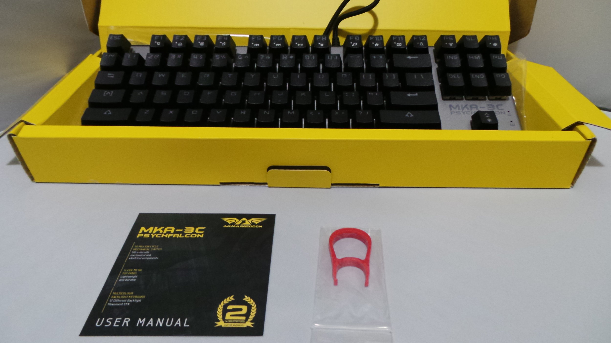 Included in the box is a key pulling tool, and a slip of paper that's a hotkey guide