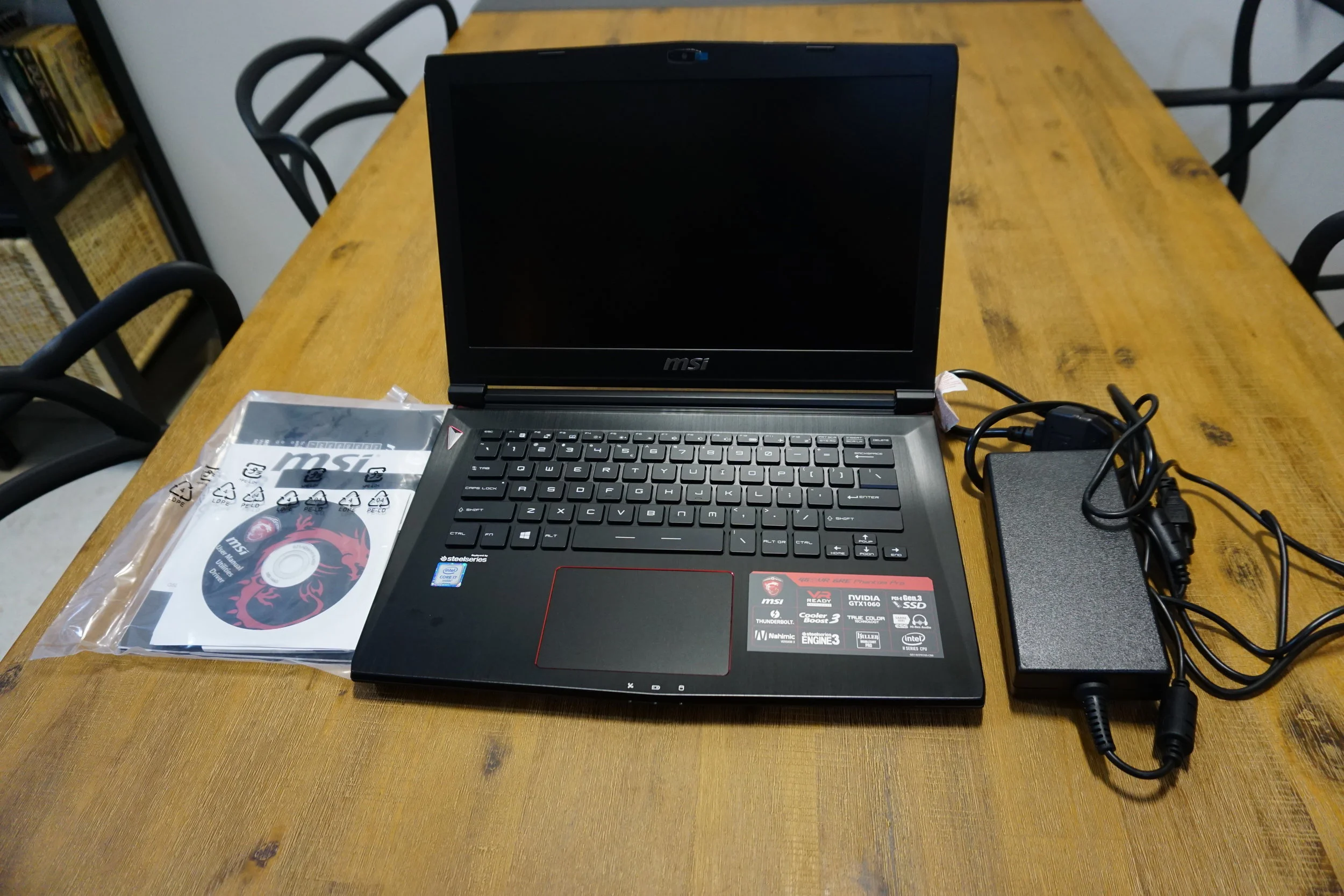 Once opened and fully unwrapped the packaging consists of a power brick, the laptop, manual and DVD driver kit.