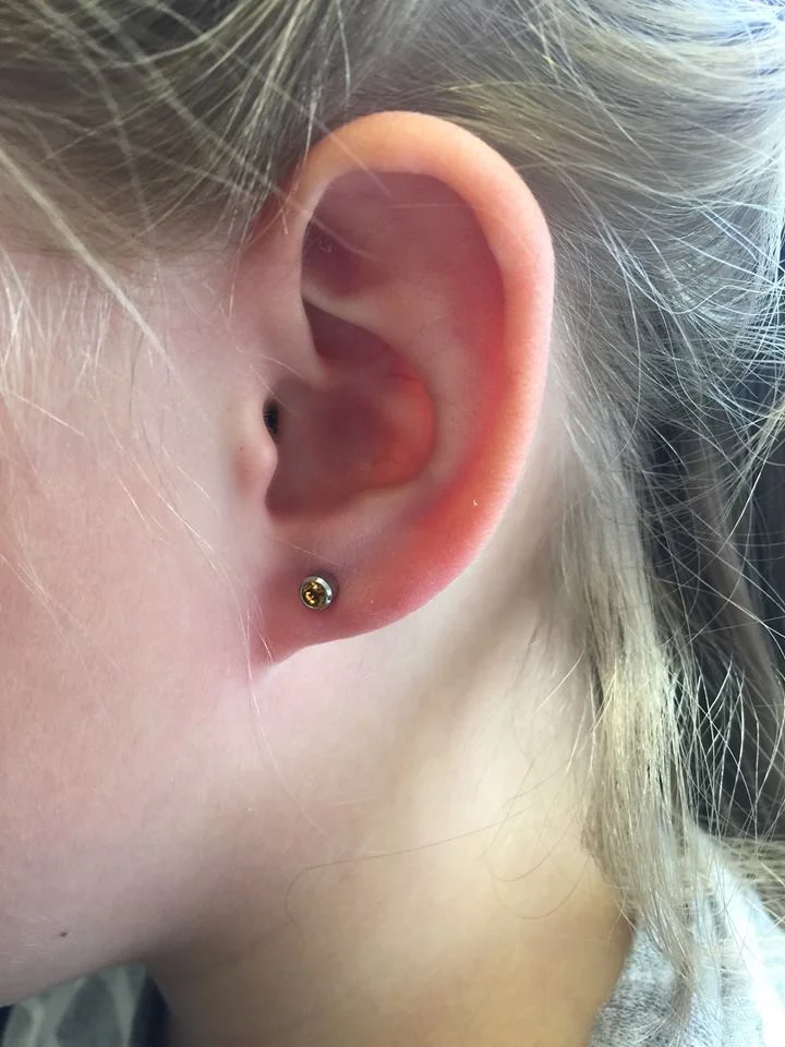 First ever lobe piercing! Very brave little girl. By Rebecca.