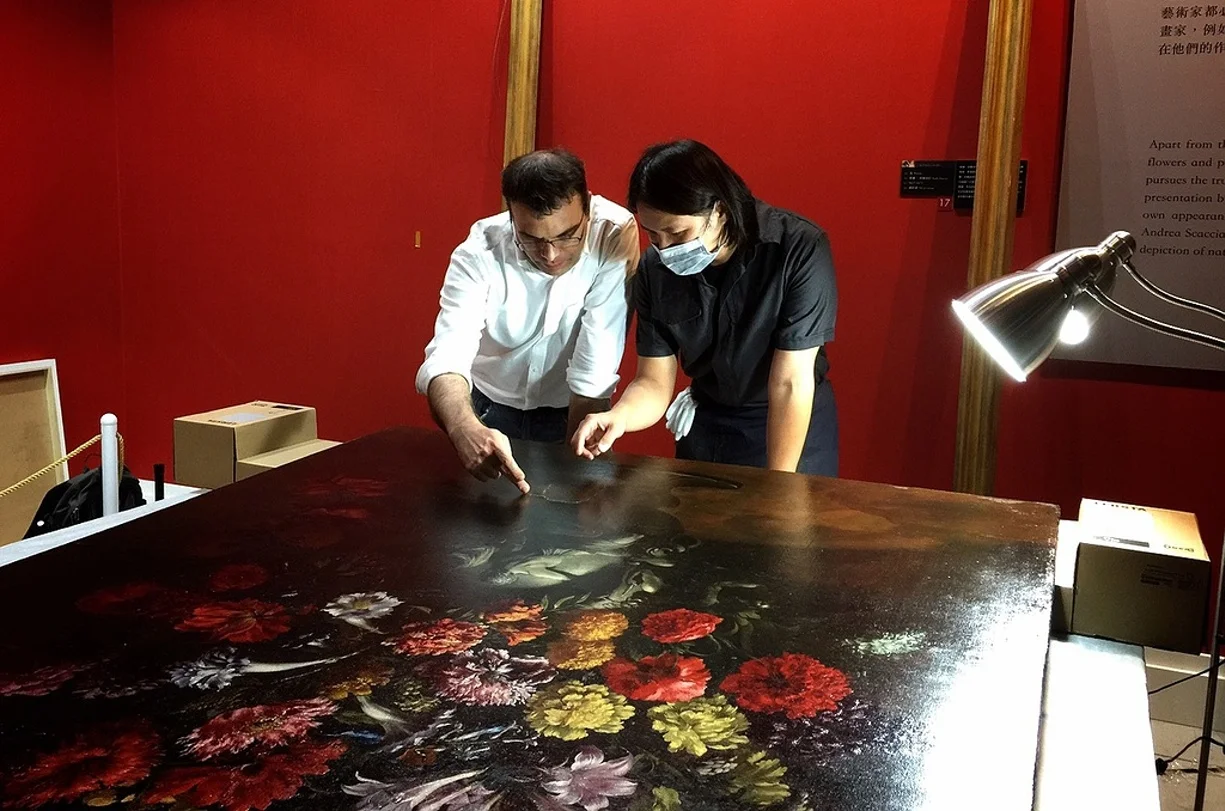 The museum's chief restorer Tsai Shun is reviewing the damage to the painting in Taipei. Photograph: TST Art of Discovery Co. Photo credit: The Guardian website