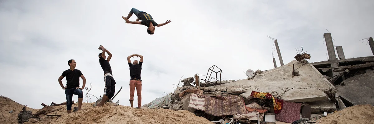 Adolescent boys in Gaza practicing parkour,&nbsp;a sport skill around obstacles.&nbsp;Source: Alessio Romenzi/UNICEF