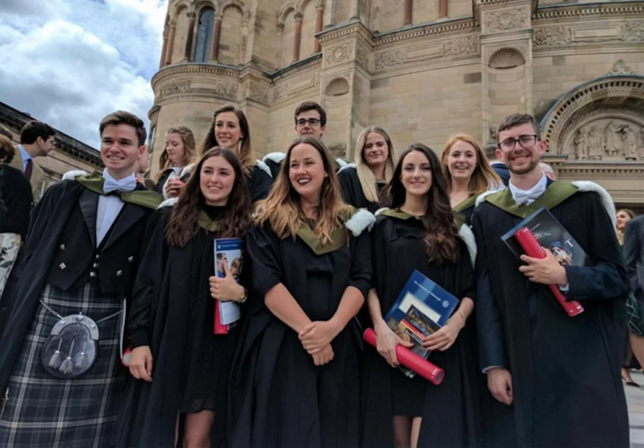 Nick Walsh (far right)&nbsp;and other recent graduates of the University of EdinburghCredit: Nick Walsh