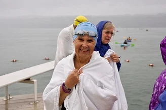 Wrapping up a swim across Cayuga Lake that helped Hospicare raise $370,000