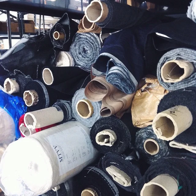 Fine fabrics. Rolls as far as the eye can see. Ariston, Vitale Barberis Canonico, Loro Piana, Holland and Sherry, Dormeuil, Ermenegildo Zegna and everything in between! #thehookscompany #headquarters #factory #textiles