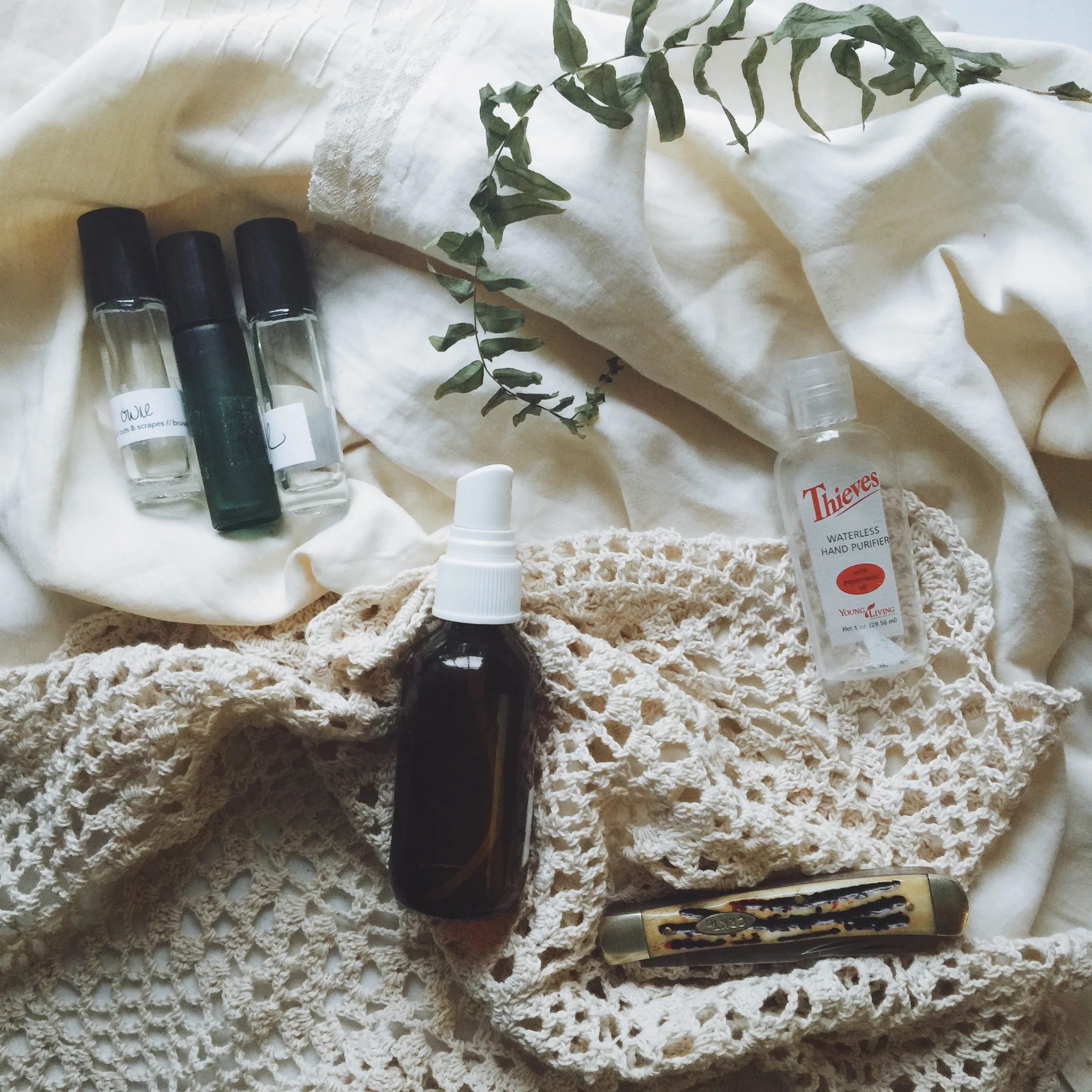 our outdoor essentials- itch stick, lavender, outdoor spray, thieves purifier and a knife!