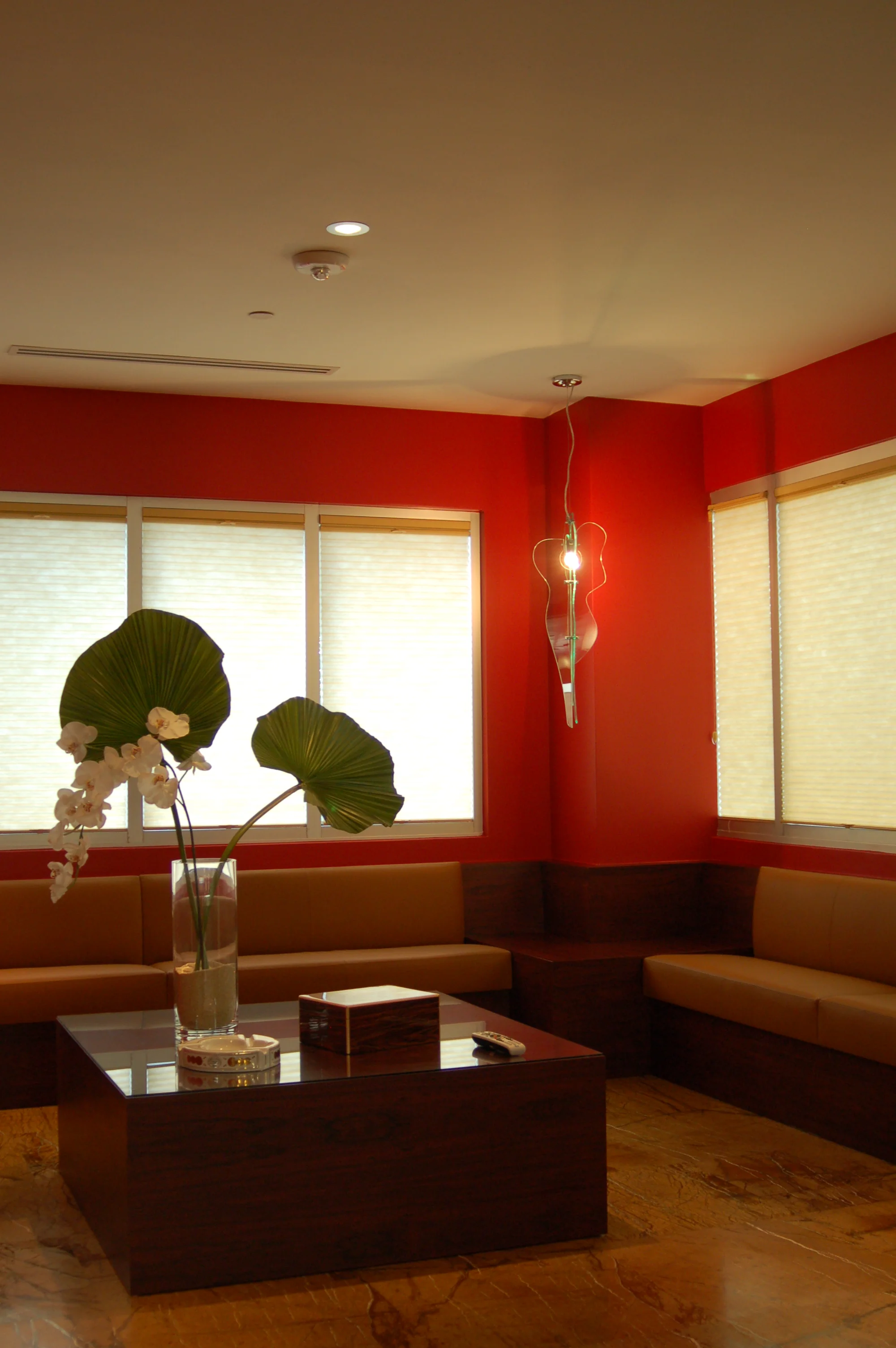  Cigar Lounge with custom leather couch, coffee table, and lamp by OA Architecture 