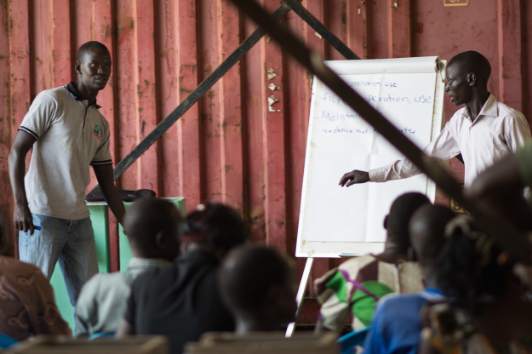 Matthew training community health agents in Yei on the operation and construction of biosand filter technology, February 2016.