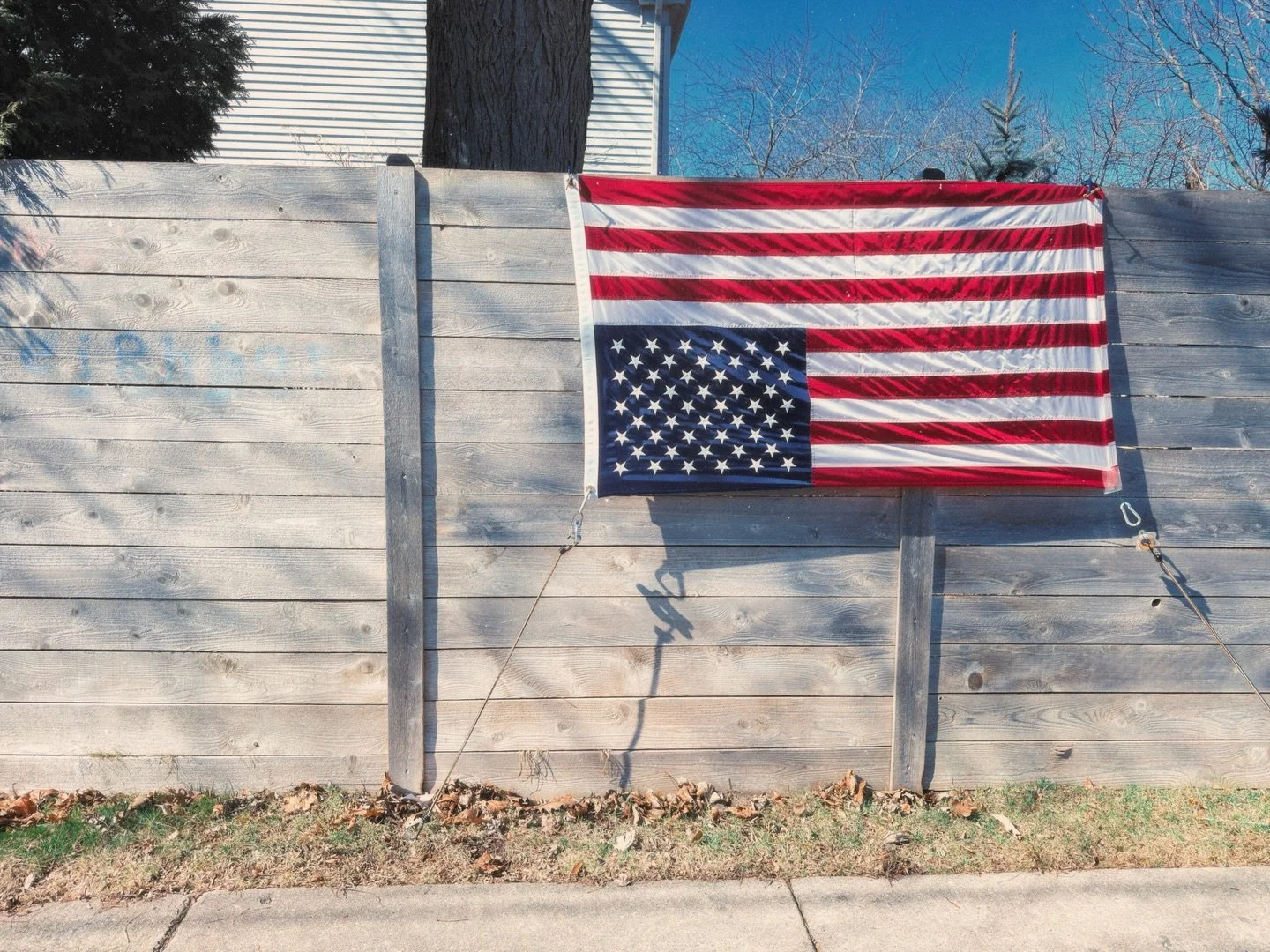 #64 Out for a Sunday walk and came across this upside down American flag with the phrase &ldquo;Love thy neighbor next to it.&rdquo; The state of play in today&rsquo;s zeitgeist can best be described as a startling and numbing confusion, as instituti