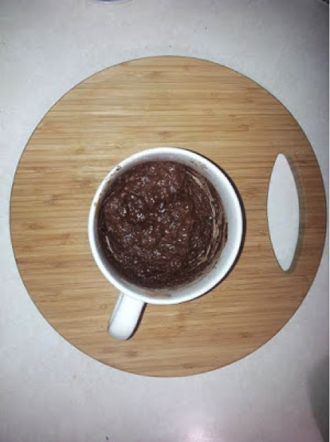 Muffin mixture before cooking in a large latte cup. One of our clients adds a sliced strawberry or a few blueberries to the mix for variety. 