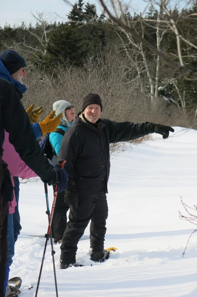 Here’s naturalist Chuck Whitney, whom I mentioned earlier, sharing his outdoor expertise. He was a cornerstone of the festival, not only leading hikes but also giving a winter-birds talk, playing the Irish flute in evening music jams and sleeping each night in the quinzhee snow hut that he and other festival attendees built.