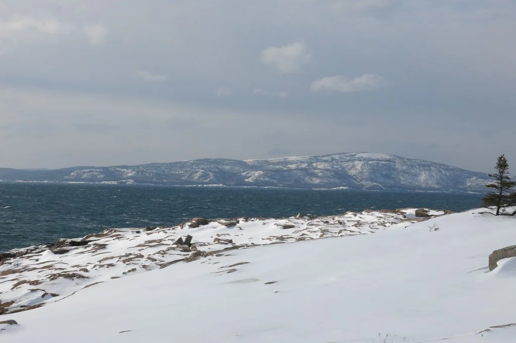 Each day Cadillac looked a bit different from Schoodic Point. Sometimes crashing waves sent spray far in the air in the foreground.