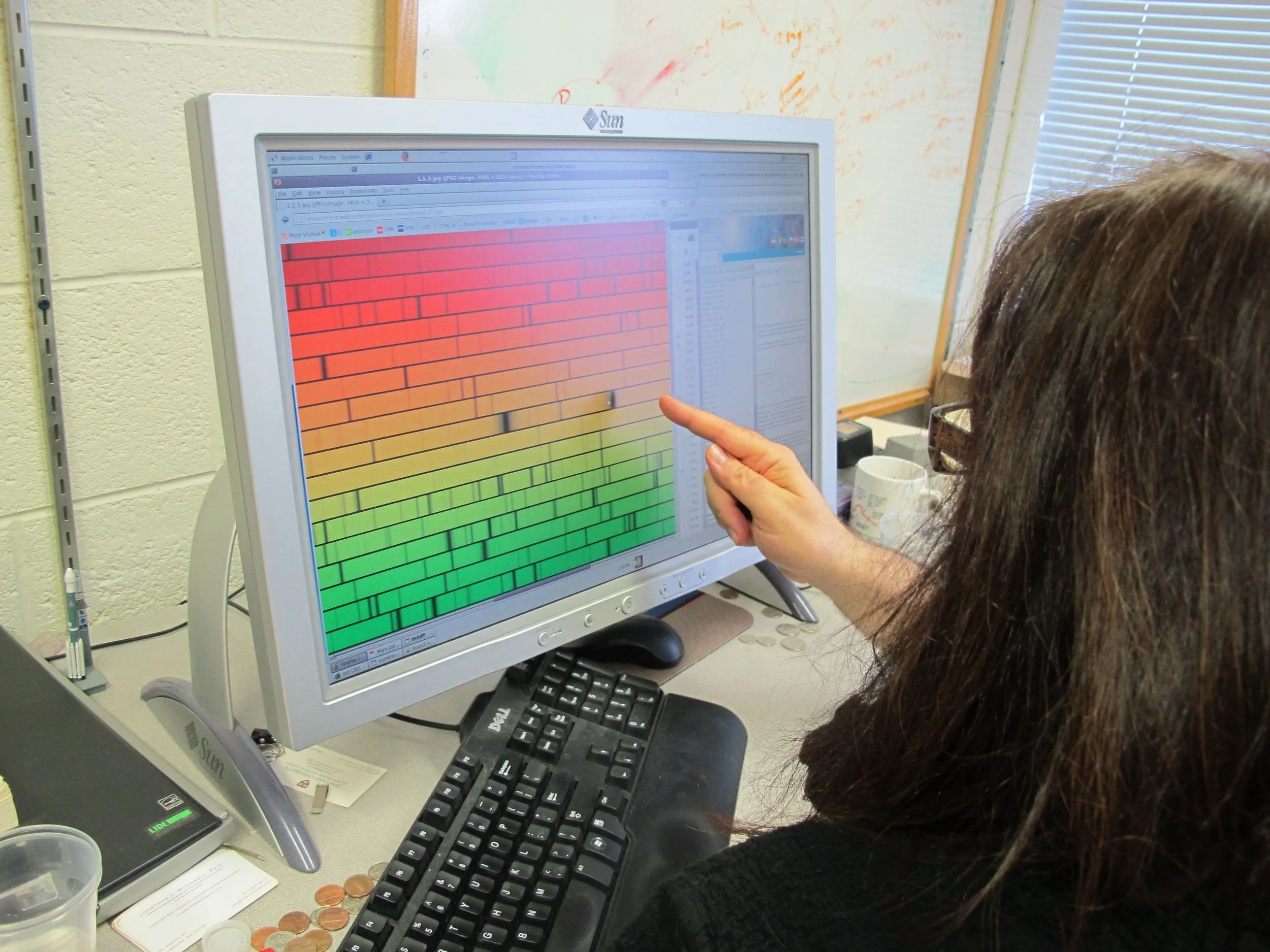 Jonathan showed us how he and other astrophysicists read information gathered by Chandra. The black lines in the spectrum enable them to figure out (among other things) what chemical elements are in a star (each element has a unique set of black lines in its spectrum) and how fast a star is moving away from the Earth.