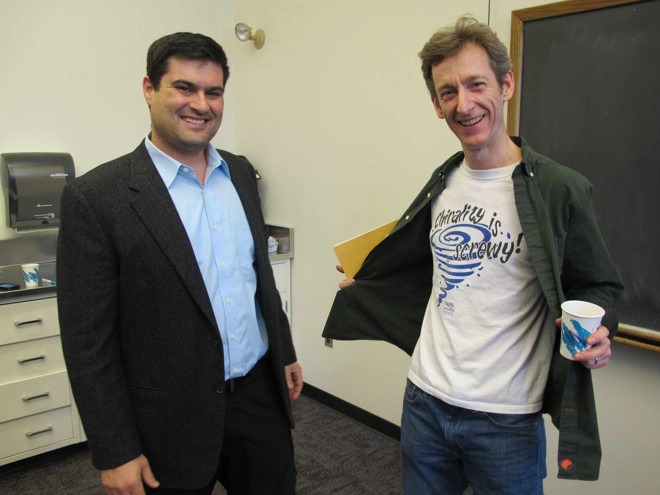 Before the lecture, esteemed Dartmouth cosmologist Robert Caldwell showed Brian his CHIRALITY IS SCREWY T-shirt. What is chirality, you ask? As best as I understand it (which is roughly), it’s the trait of an object (anything from a molecule to the universe) not being identical to its mirror image. It’s sometimes linked metaphorically to the concept of right-handedness and left-handedness. Cosmologists are now studying whether components of the universe are, if you will, more right-handed, more left-handed, or perfectly symmetrical.