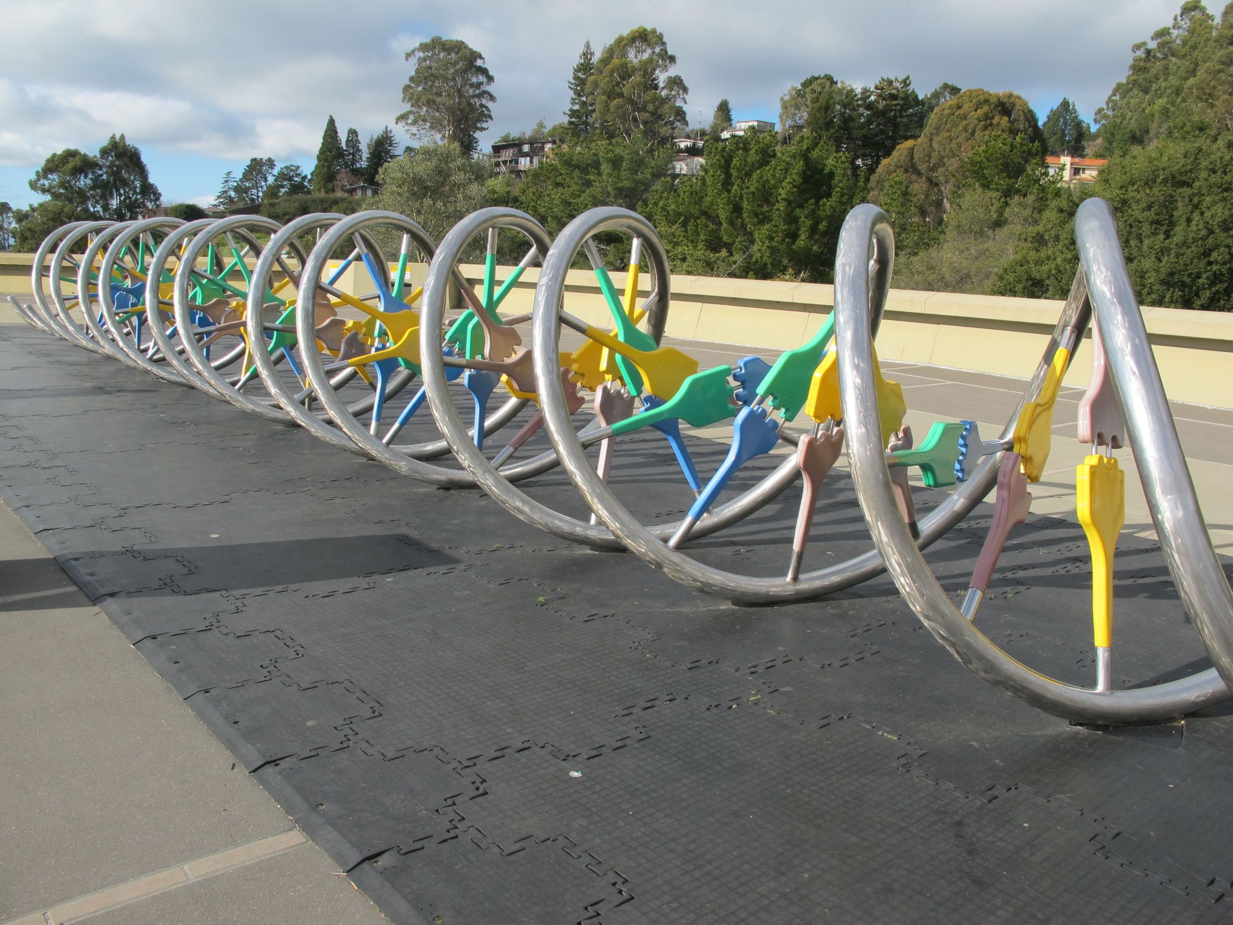 Outside the Lawrence Hall of Science is a large model of DNA. Those silvery pipes are the tk. The plastic connectors .