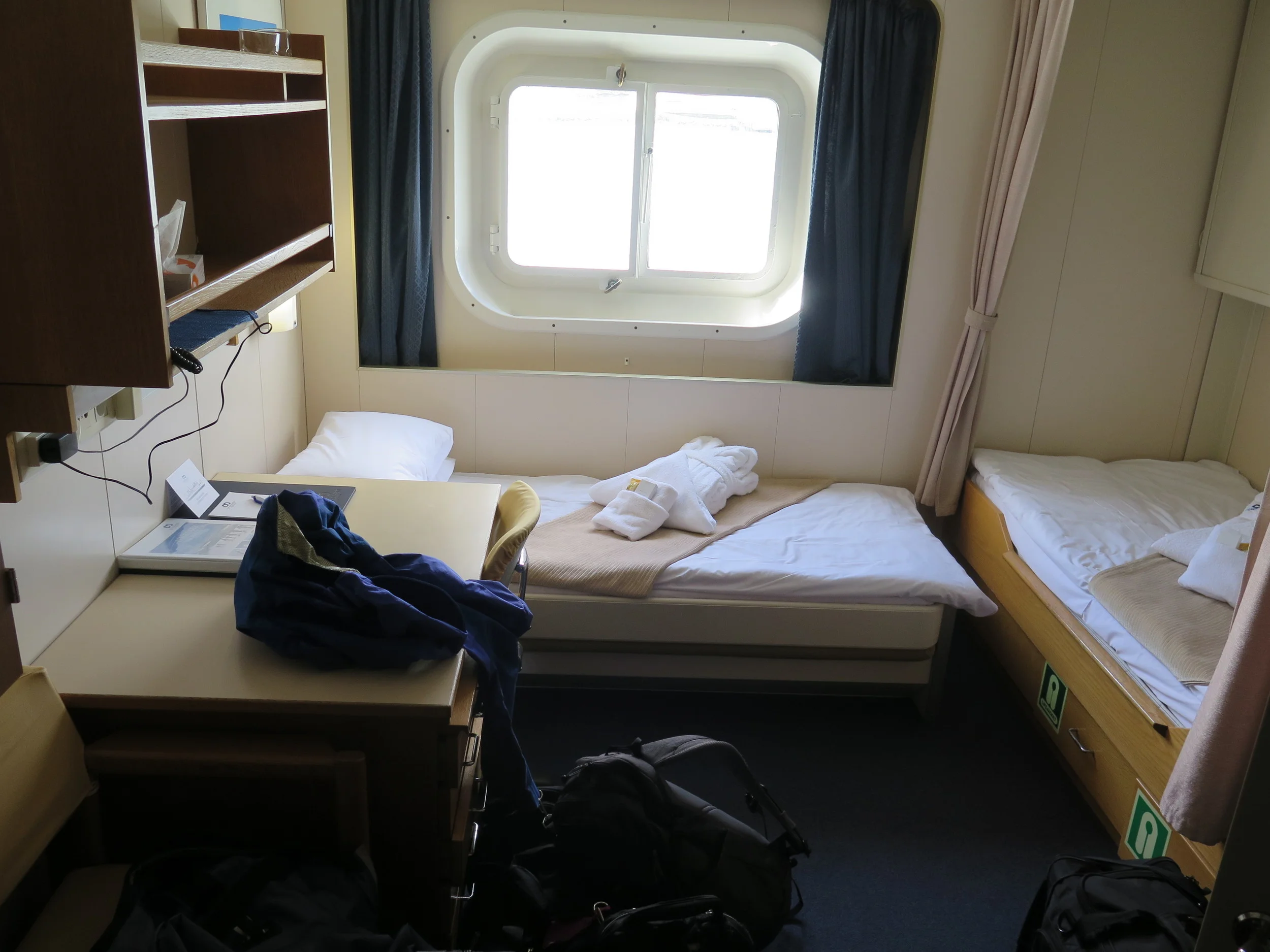 Our delightful fifth-deck cabin on the six-level ship offered us two beds, a desk, ample storage space, a combination bathroom-shower and a view off the starboard side that would soon include petrels, gulls, terns, albatrosses, whales, dolphins, seals, stunning mountain landscapes and startlingly mountainous waves.