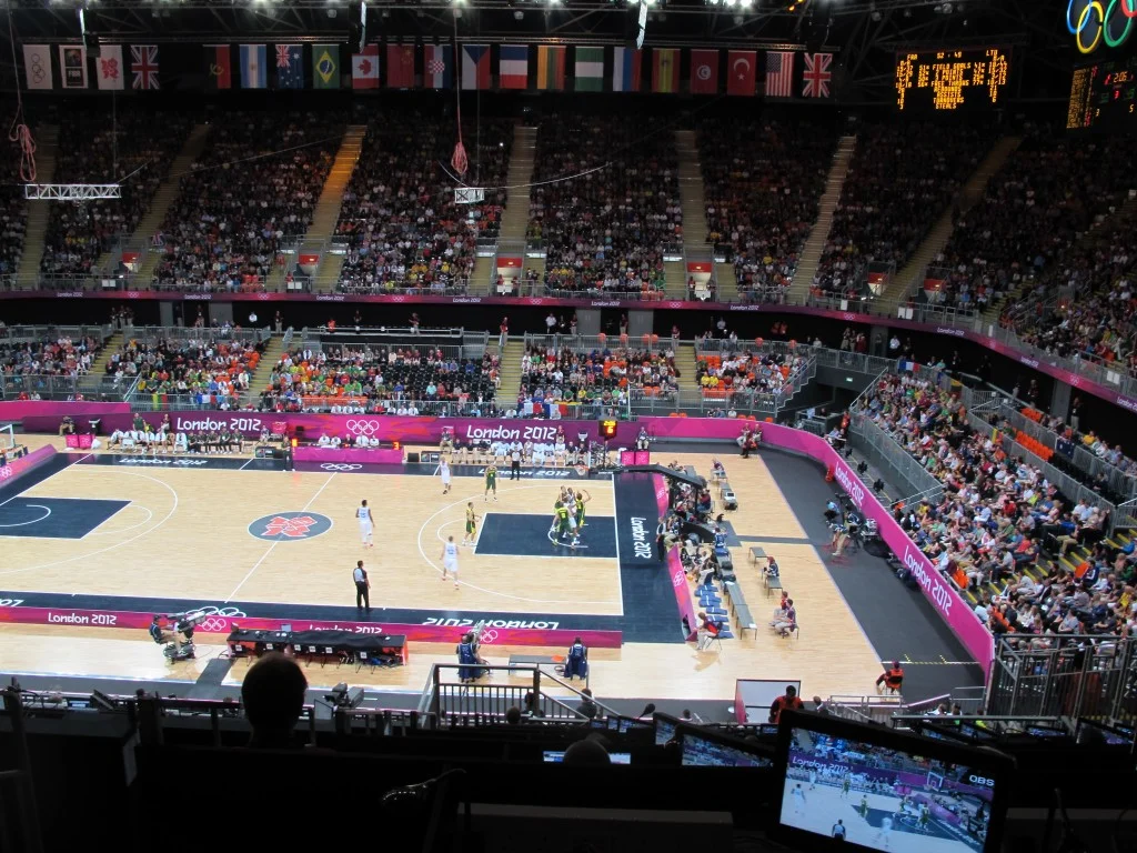 I caught the last two quarters of a Lithuania-France basketball game. This temporary arena will be moved to Glasgow, Scotland, to be used in the 2014 Commonwealth Games and may then be relocated to Rio for the 2016 Olympics.