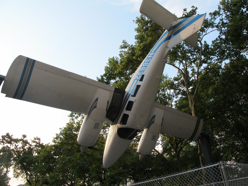 This unusual piece of public art sits just outside Central Park, near the corner of Fifth Avenue and 60th St. It’s by Paola Pivi, an Italian-born multimedia artist who now lives in Anchorage, Alaska, and it is a six-seat Piper Seneca airplane that has been modified so that it can rotate, end over end, while attached to upright braces by its wingtips. It was inspired by a story about three modern art pioneers, Constantin Brancusi, Marcel Duchamp and Fernand Leger, who were amazed by what they saw at the 1912 Paris Air Show. The motor-driven piece flips over and over is aptly called How I Roll.