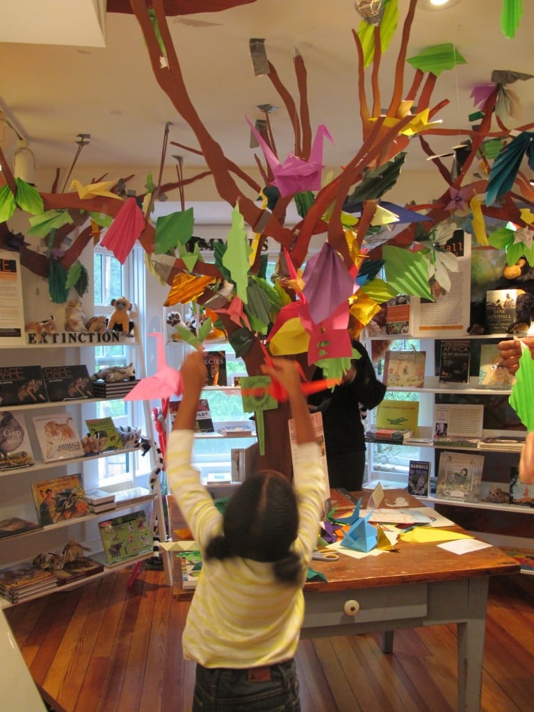 Some visitors had to jump to add their origami creations to the tree created in last year's Notebook by Melanie and Anthea.