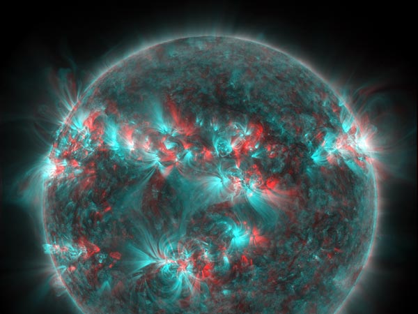 This one is courtesy of NASA. It's a new, false-color, ultraviolet shot of the recently stormy Sun. It's in 3-D, so if you have the glasses you should be able to see the solar flare jumping out at you. At least in theory.