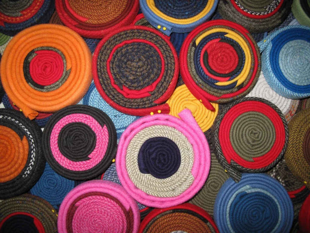 Some of our rug coils that the ocean-front tearing (plus a lot of cutting, sewing and ironing) produced.