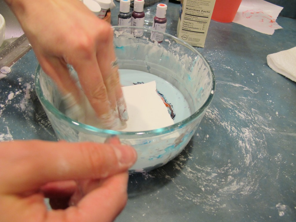 We made prints by quickly patting paper on the surface.
