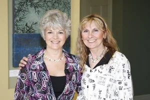 Judy (left), the author of The Inspired Garden, with Nance, the photographer (who's also a gifted maker of nature-inspired pearl and gemstone available at the Notebook).
