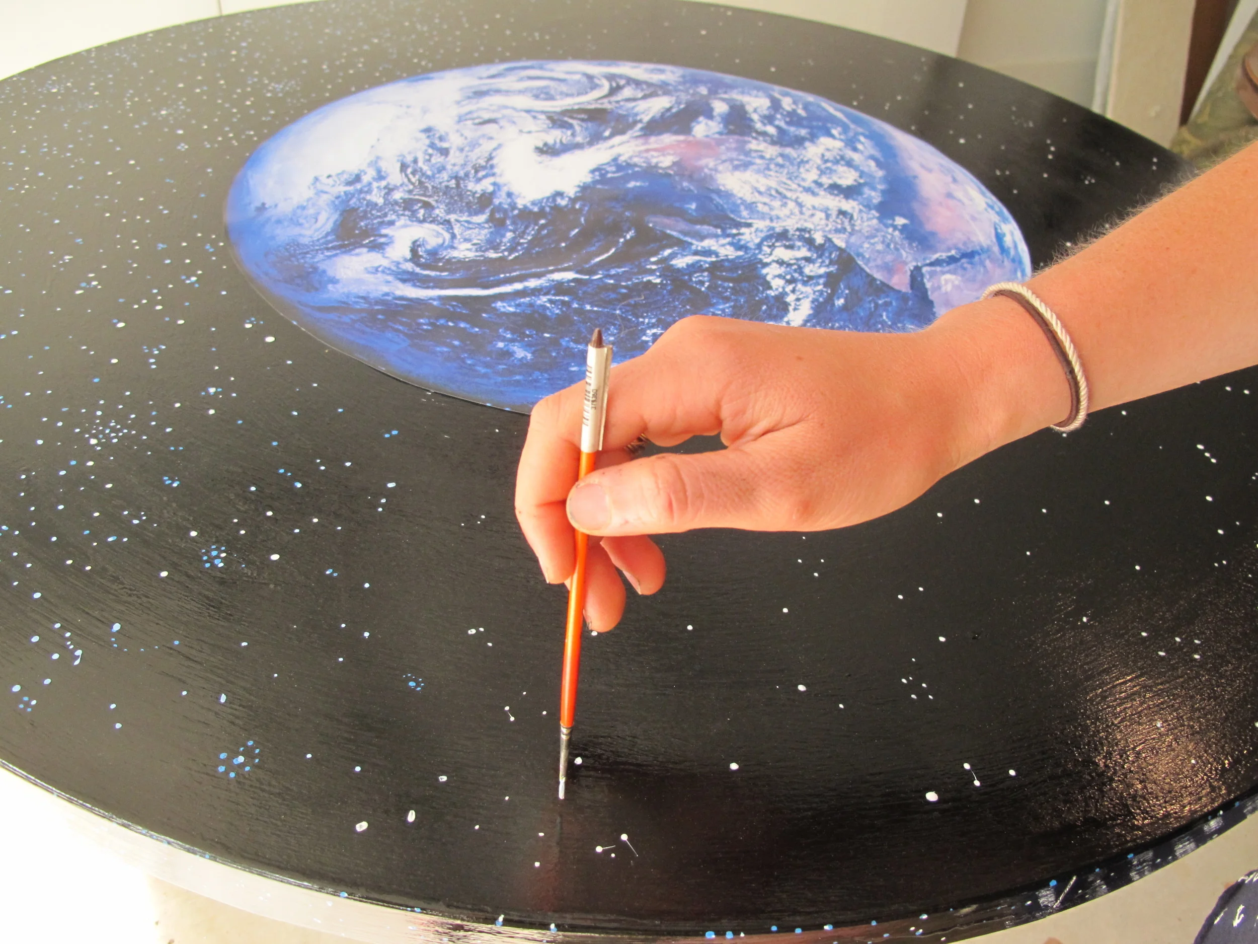 We've been creating our own universe lately with paint brushes and imagination.