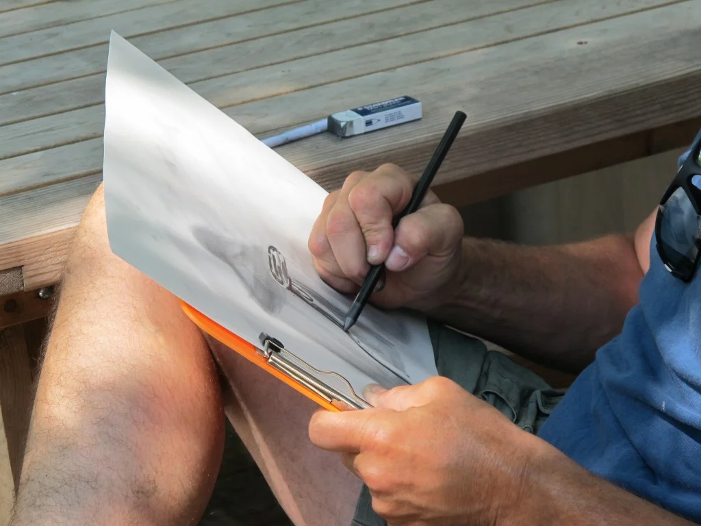 On the tree-shaded deck, each artist tested different drawing media.