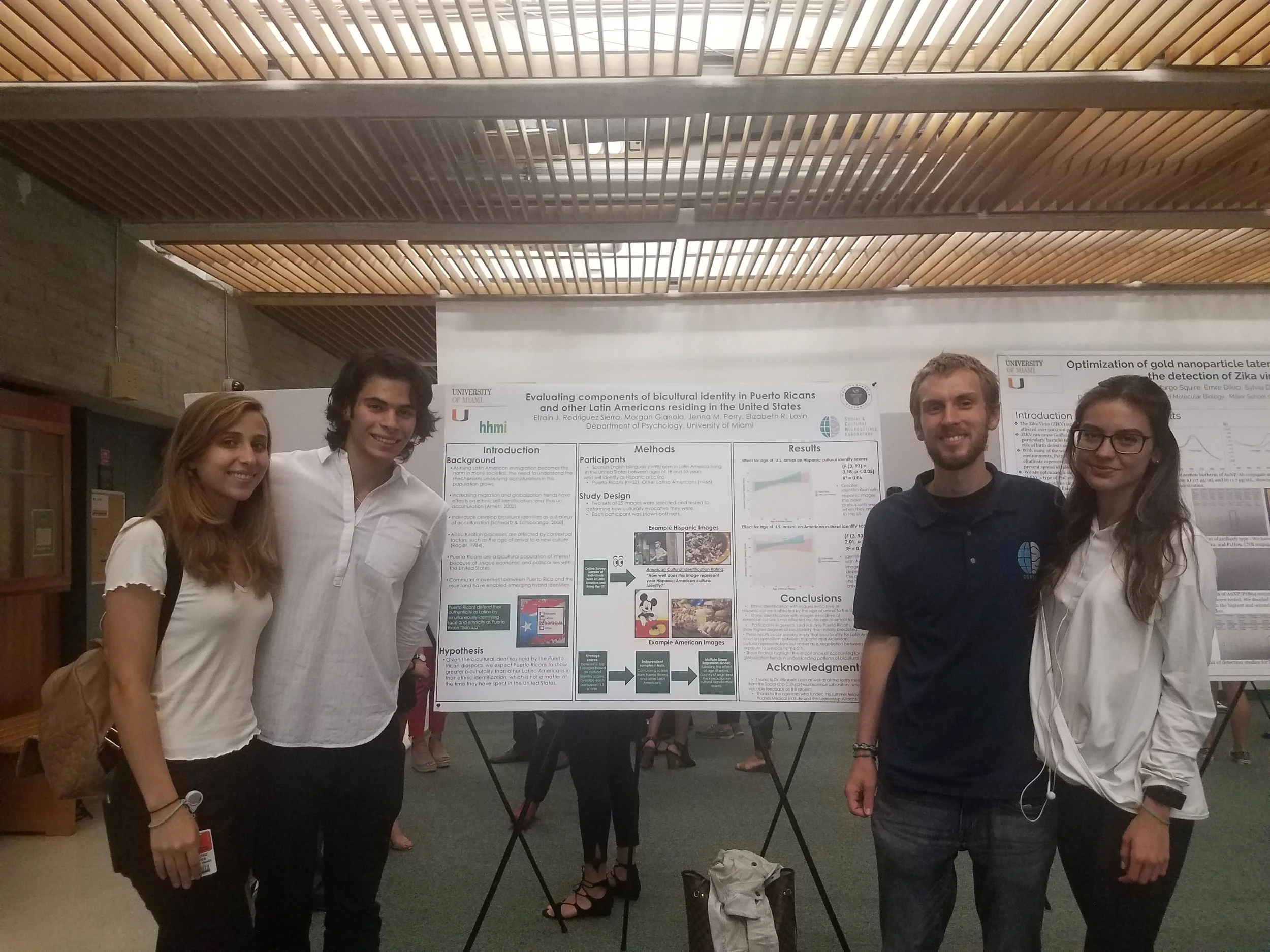 The study team poses with Efra’s poster. From left to right : Beatriz Yepes, Efrain Rodriguez Sierra, Morgan Gianola, Sofia Mercer.