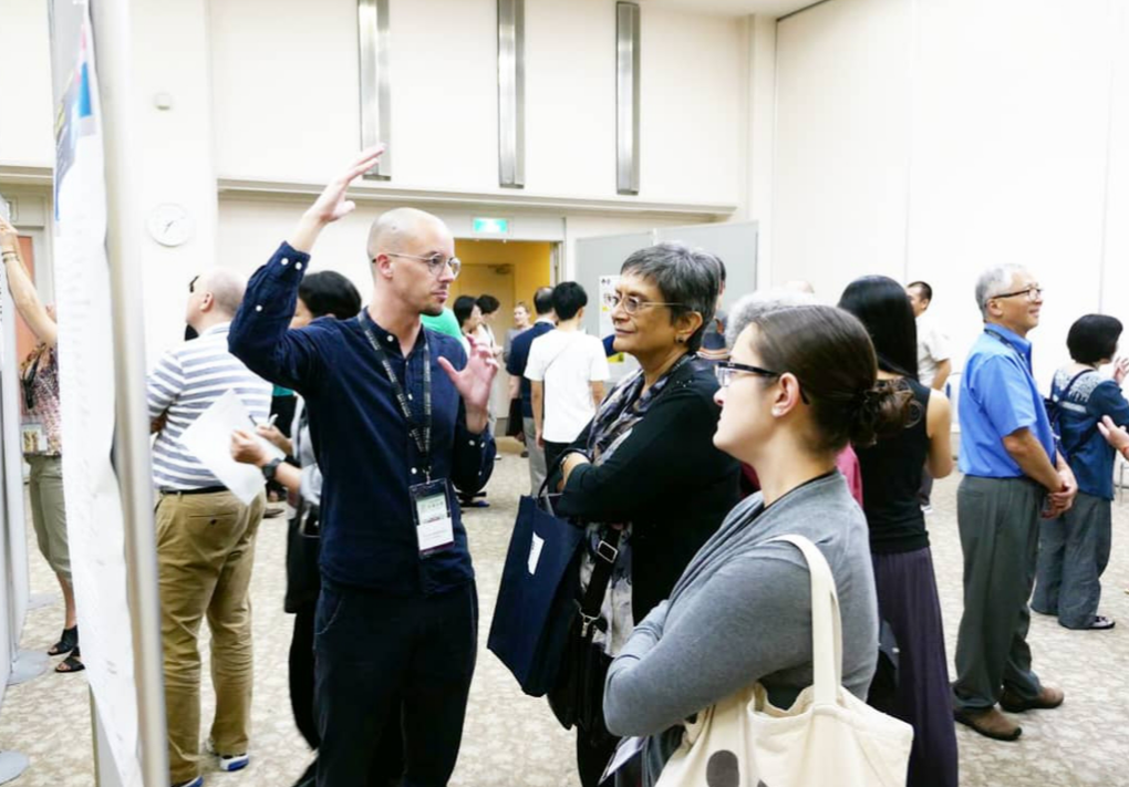 Steven Anderson discussing his poster. Image courtesy of Mind & Life International Research Institute.