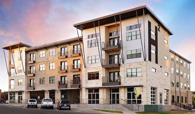 Mixed-use zoning was implemented in Denton’s greater downtown area in 2002. A variety of housing types are now available in downtown including townhomes and apartments with ground floor commercial such as the 42-unit H-Squared project (pictured abov…