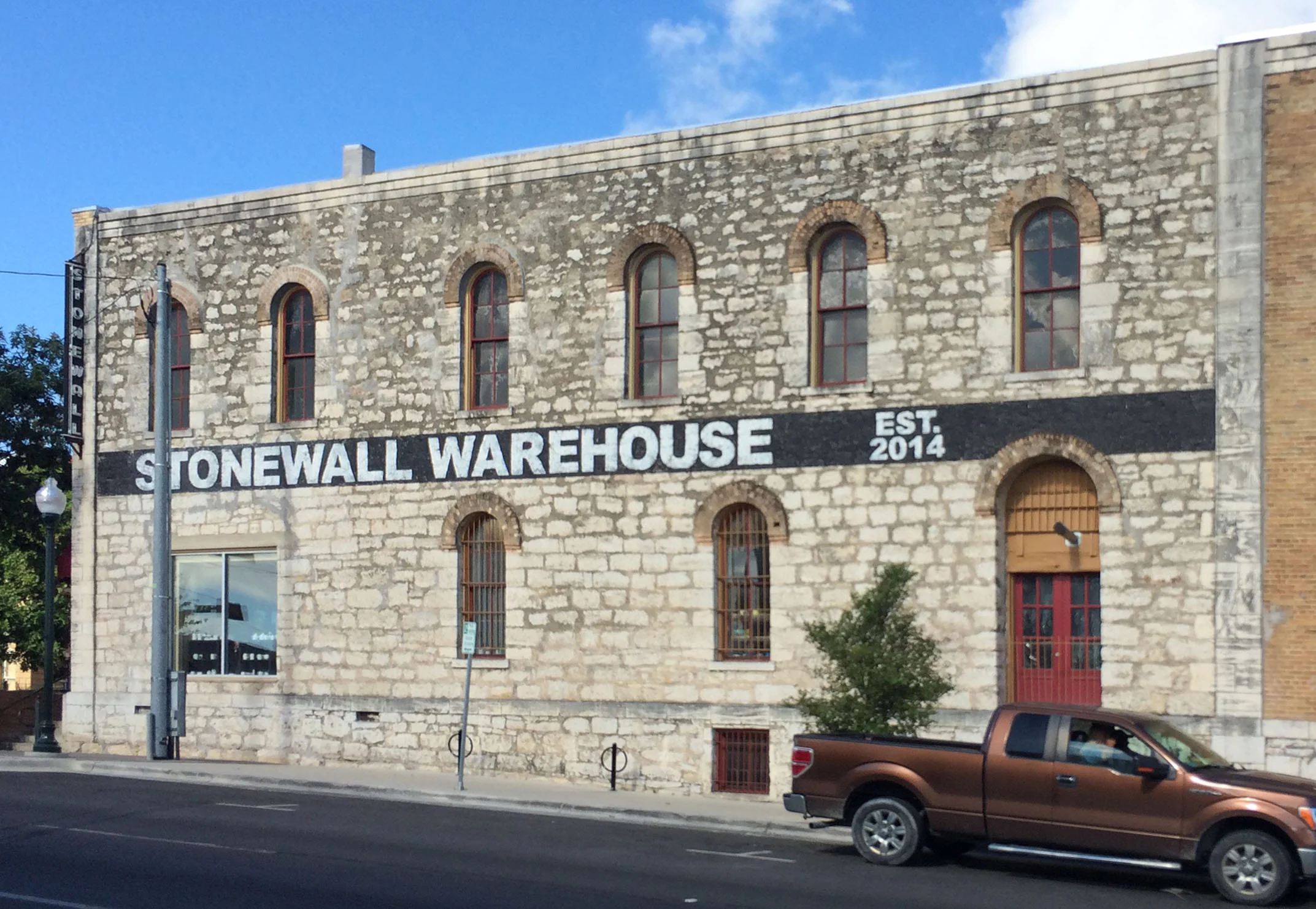 New signage painted and applied in the same appearance as historic signage.&nbsp;