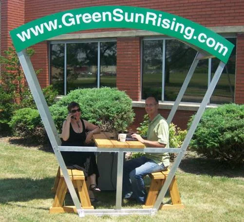 Solar bench that combines shade and charging station. Source: http://www.greensunrising.com/