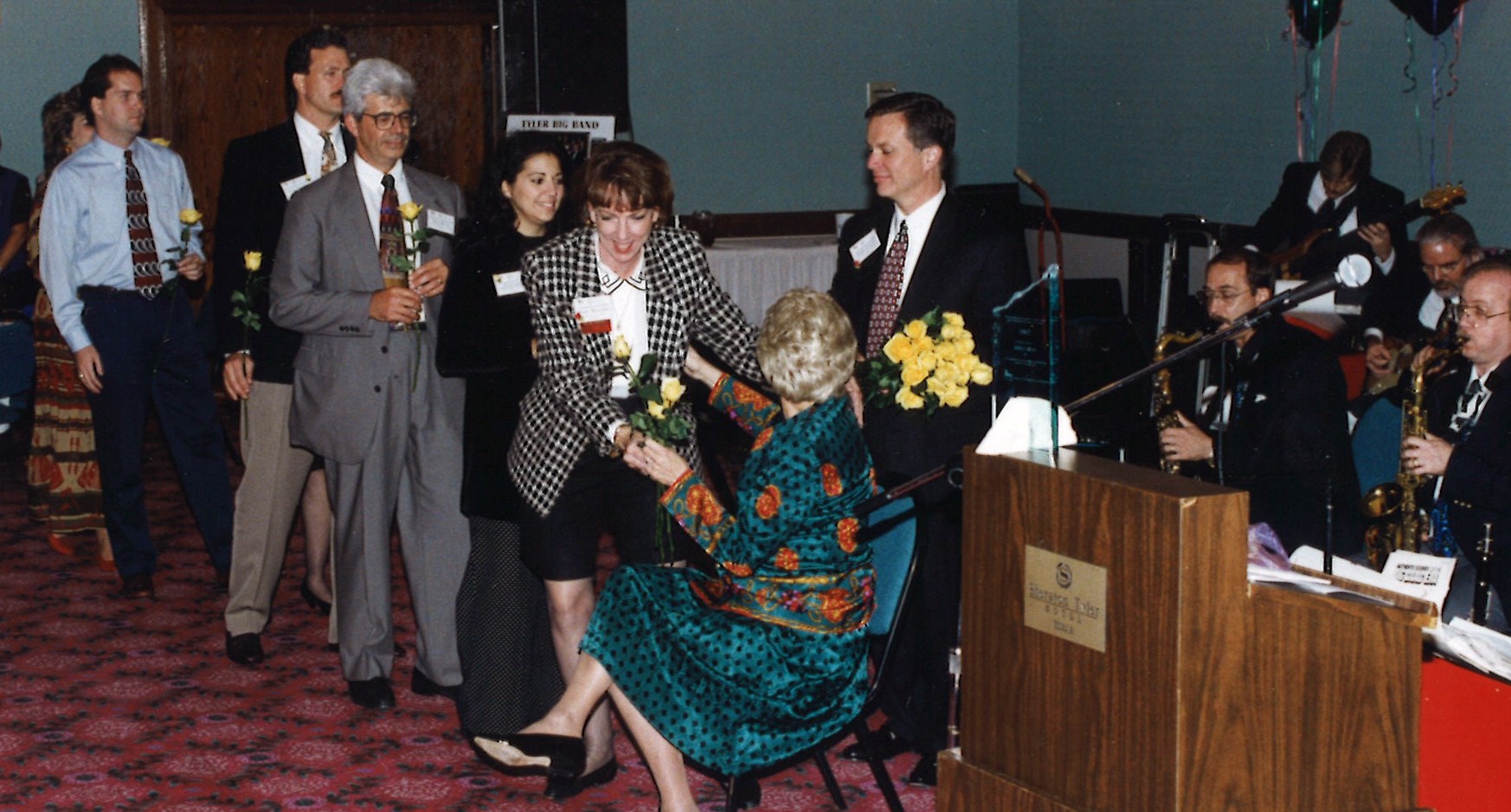 Anice was honored with yellow roses and serenaded during a 1996 meeting in Tyler by state staff andlocal Main Street managers.