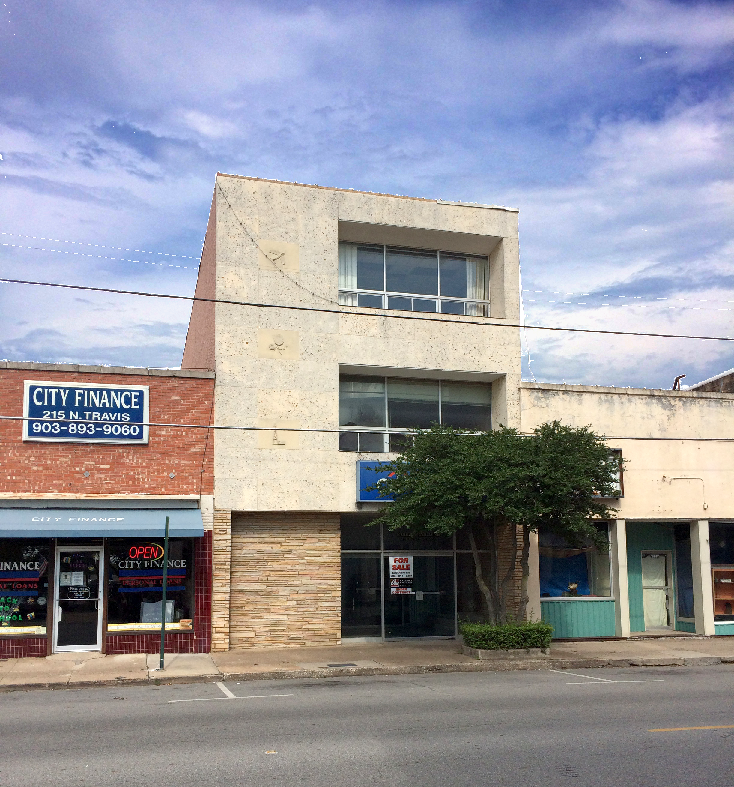A small 1930s office building is being converted to upper-story residential units in Sherman.