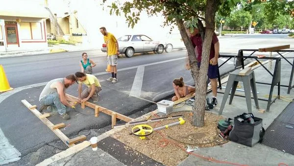 Volunteers building the parklet. Source
