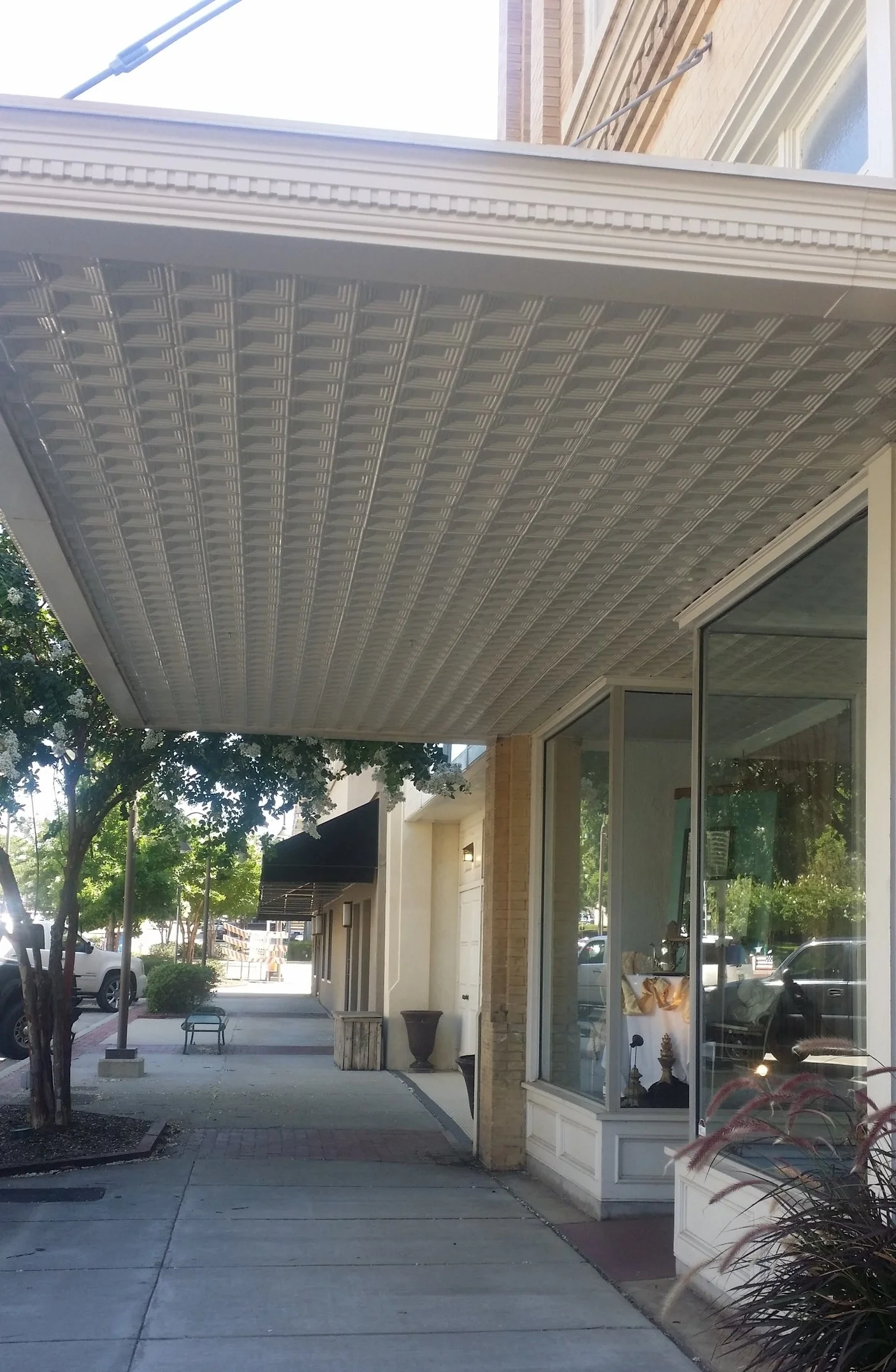 Where: Longview, TXWhen: October 2016Decorative pressed metal is not as common on the underside of a canopy, but there are many examples thoughout Texas. &nbsp;The pressed metal conveys quality craftsmanship. &nbsp;Consider when walking under a cano…