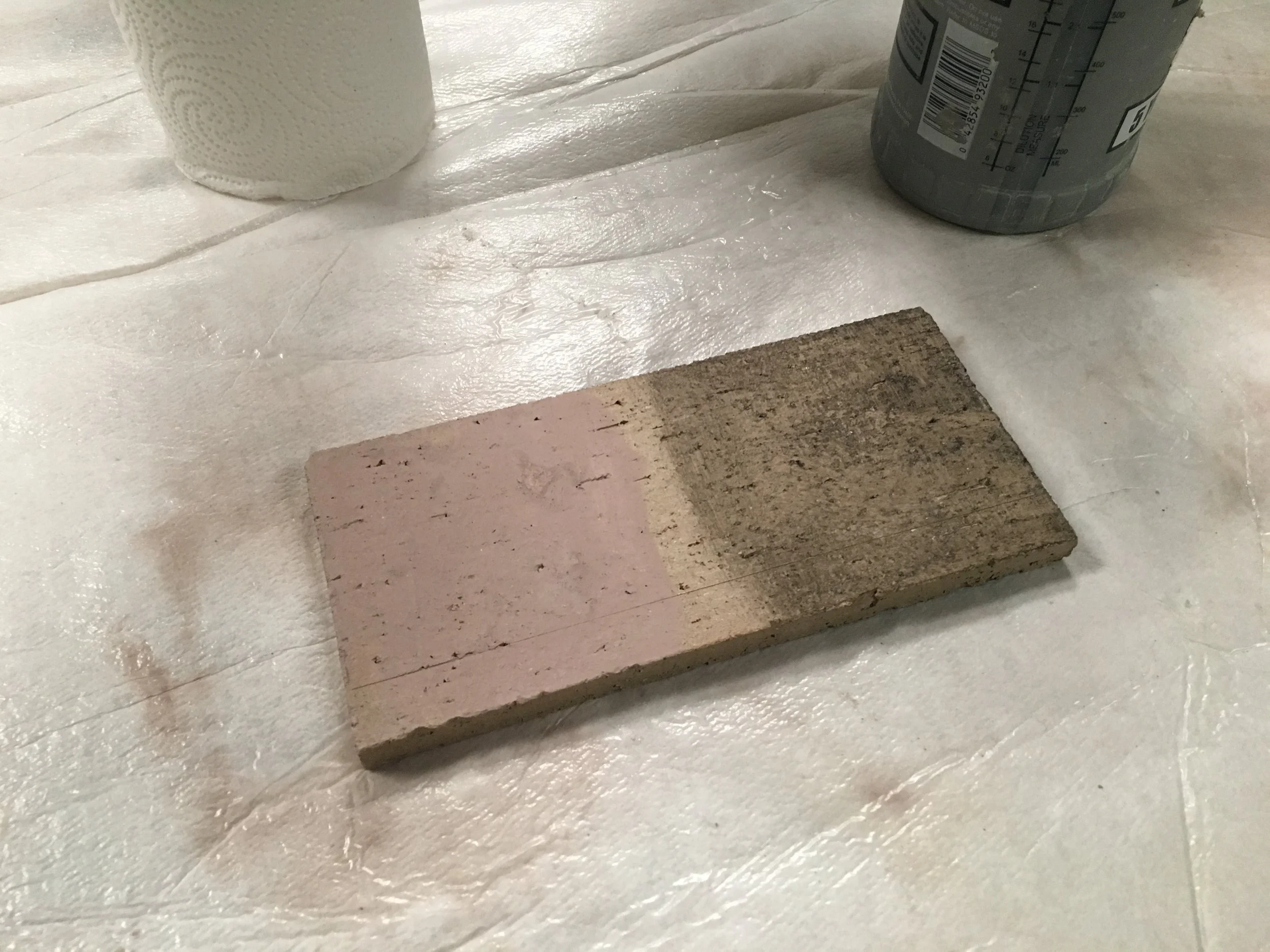 The buff brick mockup represents mud on the left and soot stains on the right.Prosoco 2010 All Surface Cleaner diluted in water was used to remove the stains. The solution was applied using a soft bristle brush and was then scrubbed by hand.