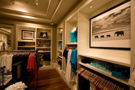 Using subdued lighting with warm colors in spotlights (left image), wall sconces, along with overhead lighting (right image source), can help showcase special pieces.