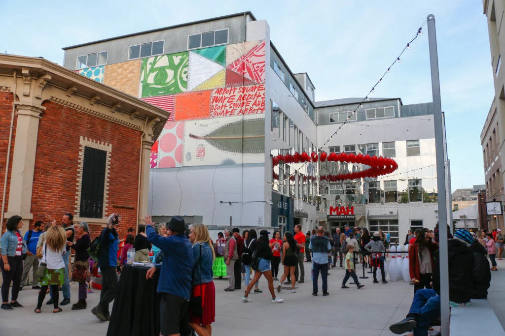 The Abbott Square incorporates food, music, family-friendly activities, art, andhistory. Image source.