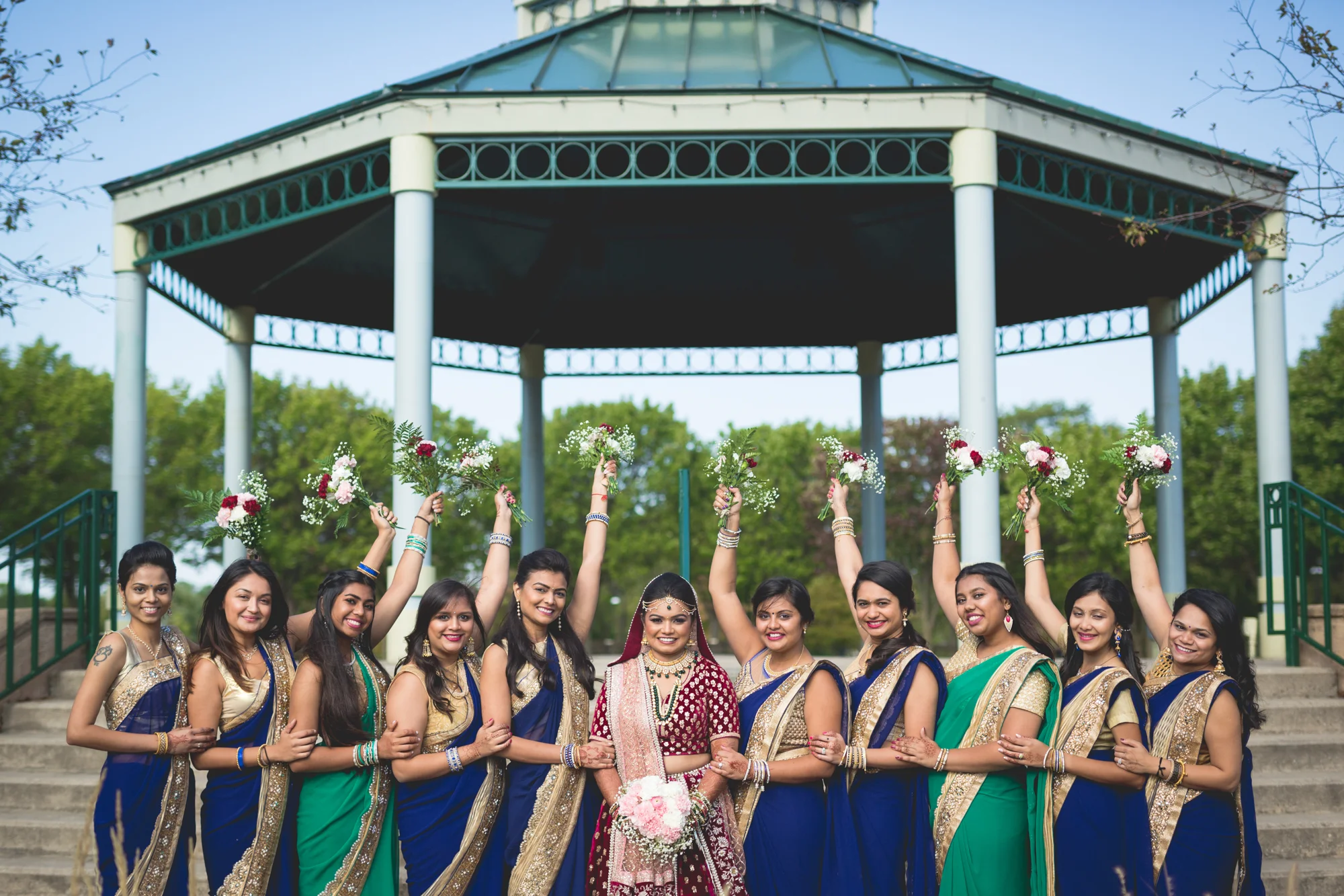 bridesmaids-holding-up-bouquets.jpg