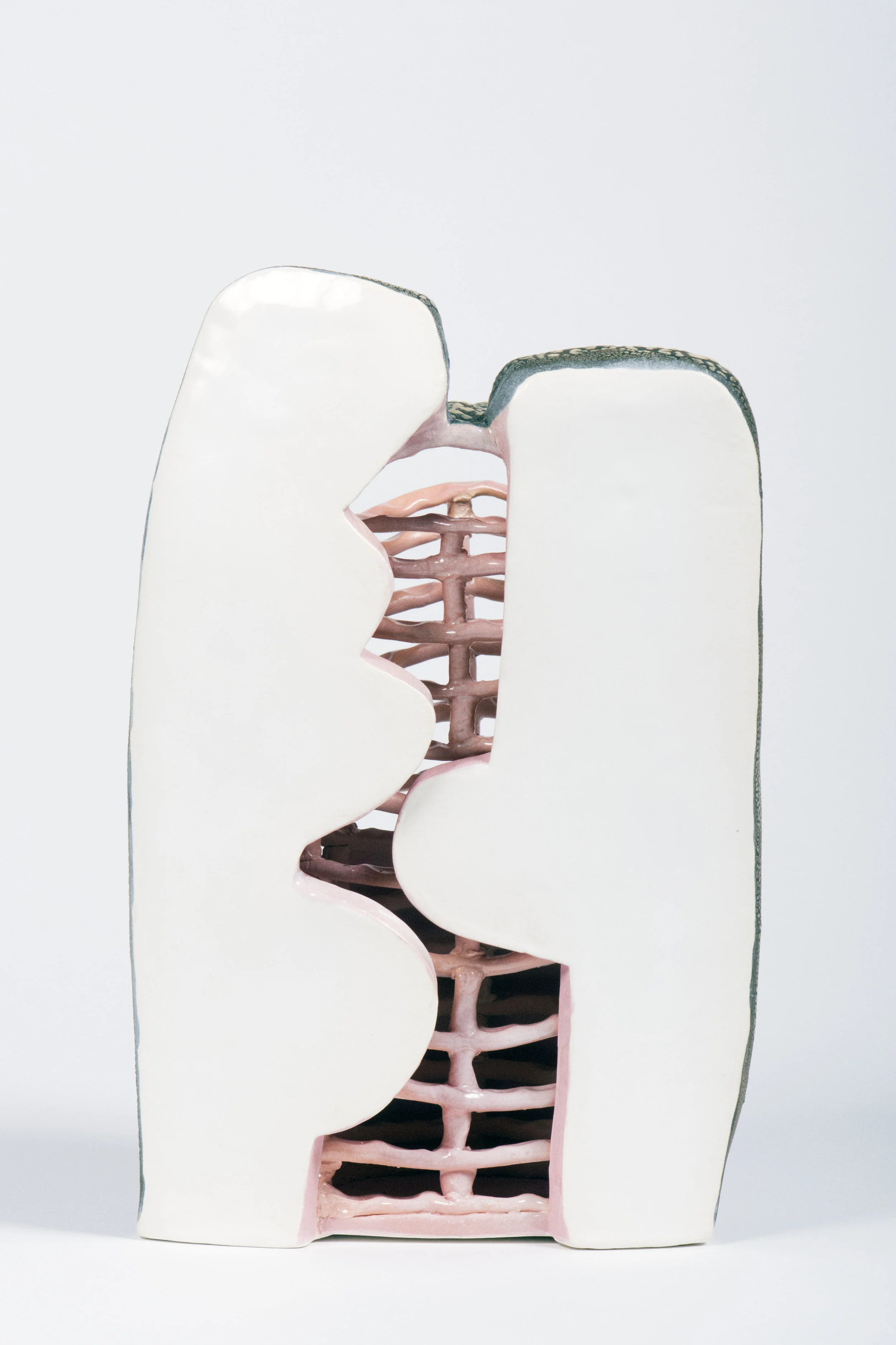 white earthenware with colored clay, underglazes, and glaze. Electric fired to cone 04.