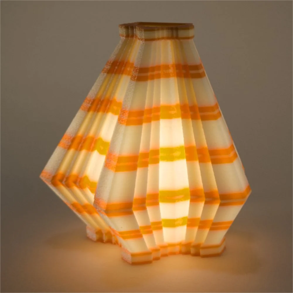 Single Facets night light in orange and lemon, glowing