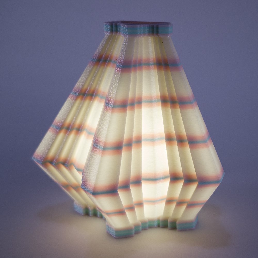 Single Facets night light in pink and blue, glowing