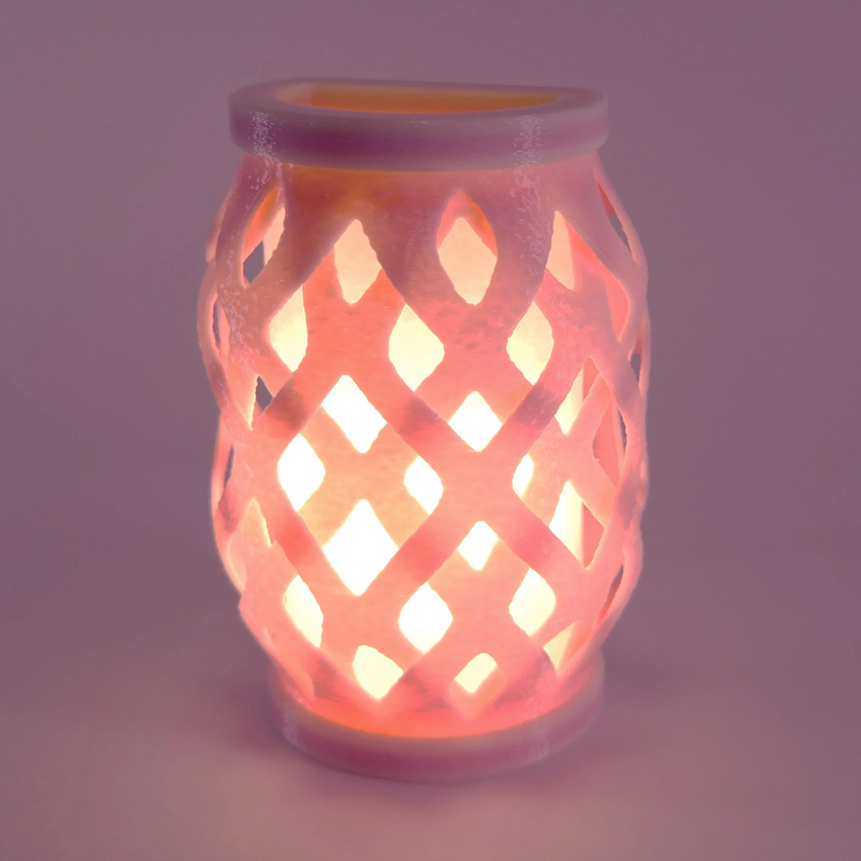 Single pink Wovenly night light, lit up