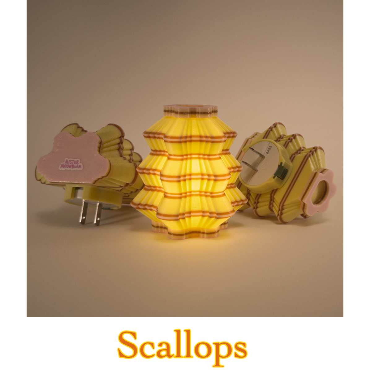 Three Scallops night lights in yellow, brown, and pink, one glowing, with plug prongs visible