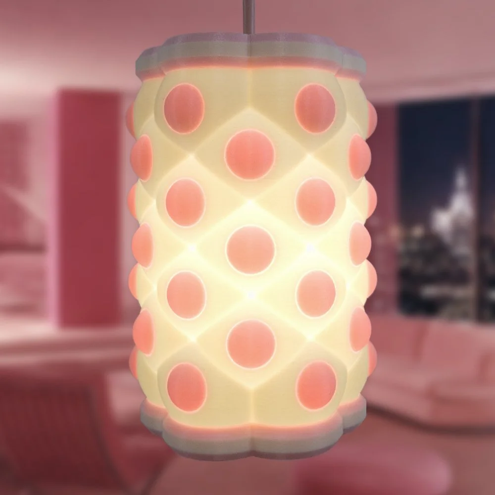Pink Polky pendant lamp hanging in a pink high-rise apartment