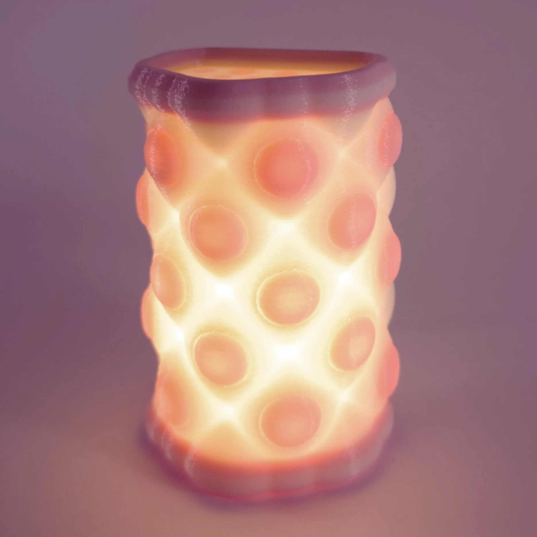 Single pink Polky night light, lit up